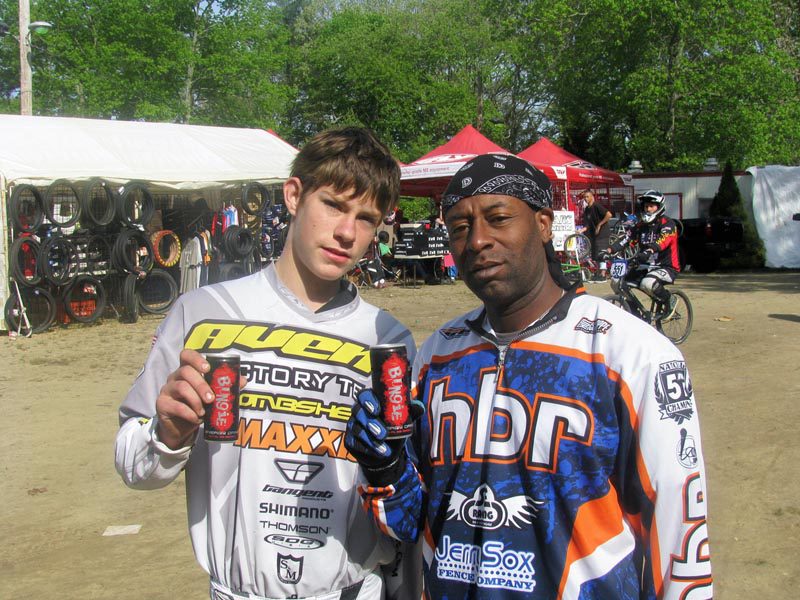 2 BMX riders holdng up cans of Bungie nergy Drink